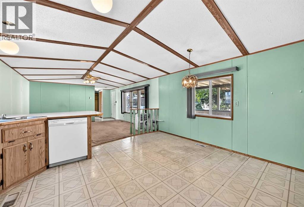 3218 Burroughs Manor NE, Calgary, Alberta  T1Y 6K2 - Photo 4 - A2328136
