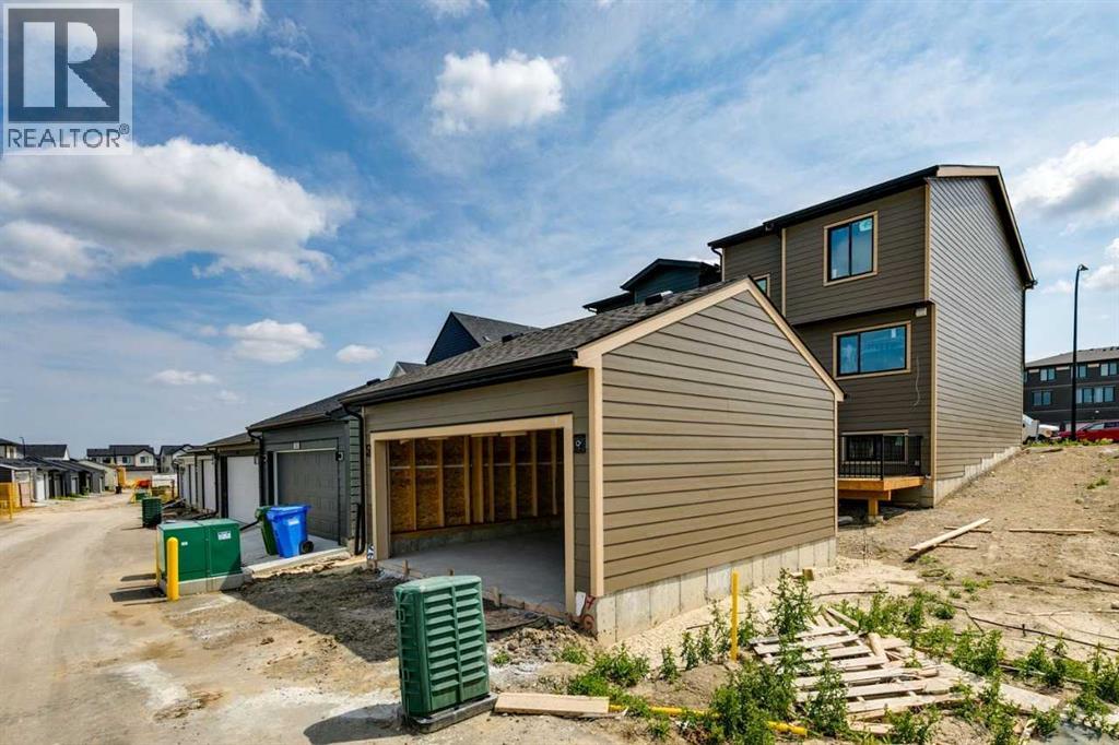 57 Bluerock Hill SW, Calgary, Alberta  T2Y 0V7 - Photo 7 - A2318473