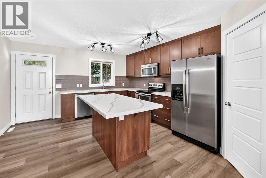 86 Pantego Lane NW, Calgary, Alberta  T3K 0T1 - Photo 5 - A2338242