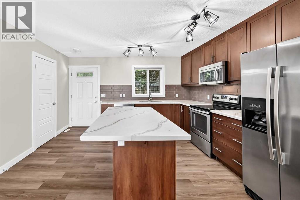 86 Pantego Lane NW, Calgary, Alberta  T3K 0T1 - Photo 6 - A2338242