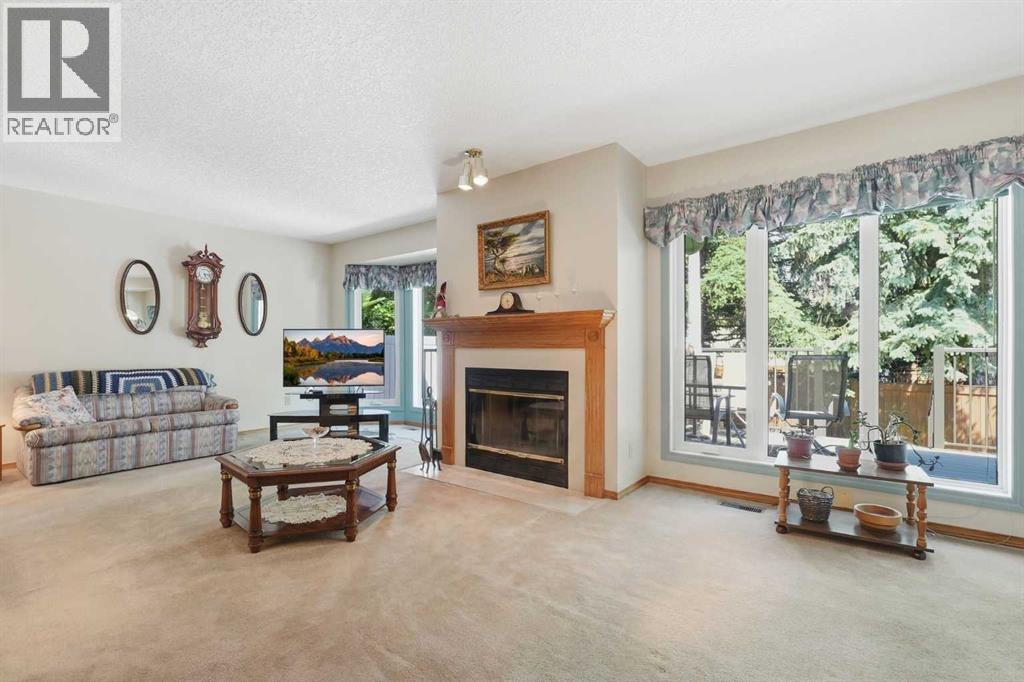 22a Woodmeadow Close Sw, Calgary, Alberta  T2W 4L8 - Photo 3 - A2317102