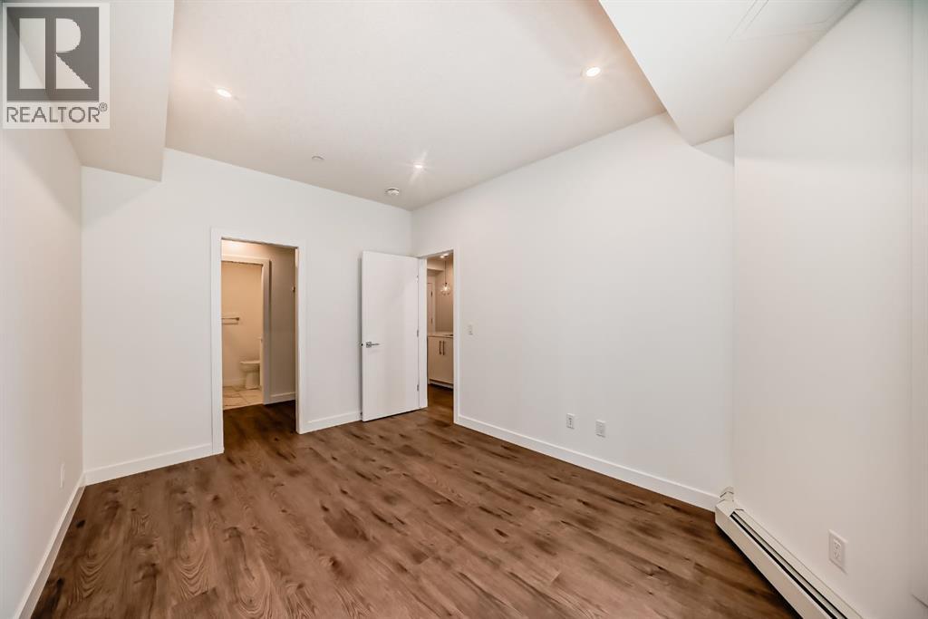 205, 8370 Broadcast Avenue SW, Calgary, Alberta  T3H 6L3 - Photo 16 - A2338975