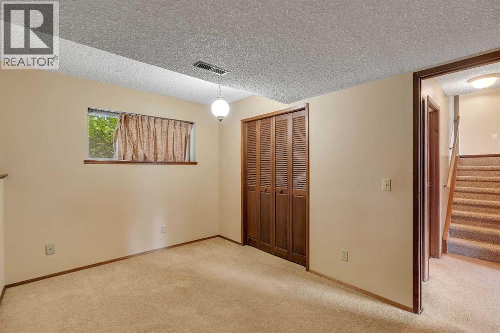 703 Woodpark Boulevard SW, Calgary, Alberta T2W 3M9 - Photo 23 - A2325598