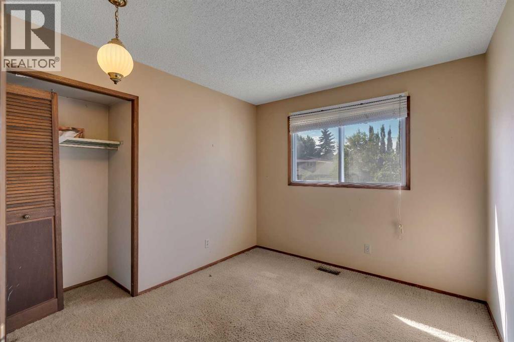 703 Woodpark Boulevard SW, Calgary, Alberta T2W 3M9 - Photo 15 - A2325598
