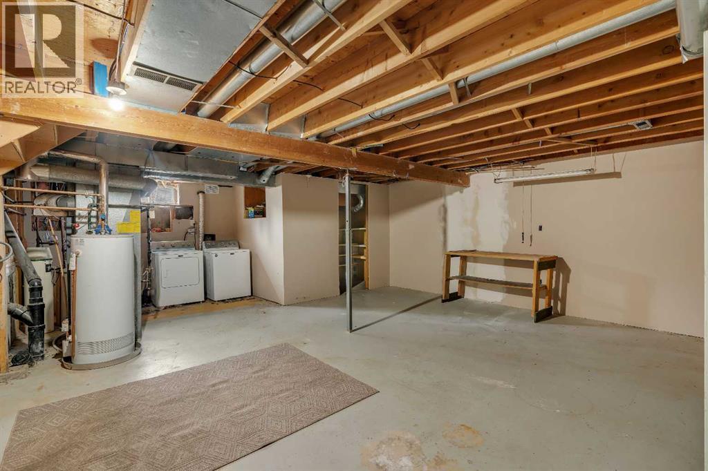 703 Woodpark Boulevard SW, Calgary, Alberta T2W 3M9 - Photo 25 - A2325598
