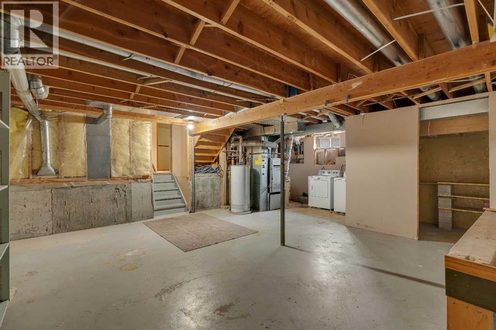 703 Woodpark Boulevard SW, Calgary, Alberta T2W 3M9 - Photo 26 - A2325598