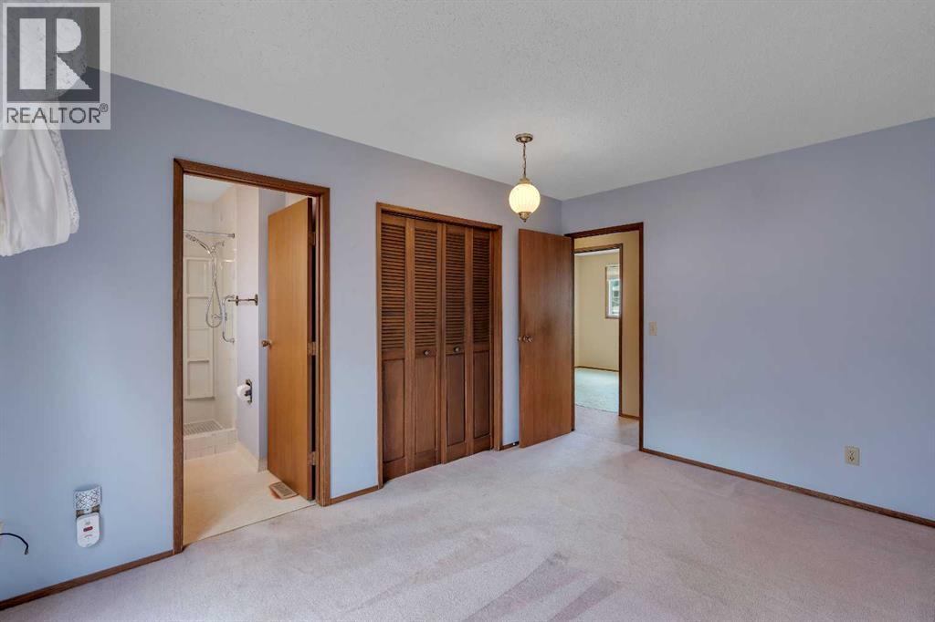 703 Woodpark Boulevard SW, Calgary, Alberta T2W 3M9 - Photo 11 - A2325598