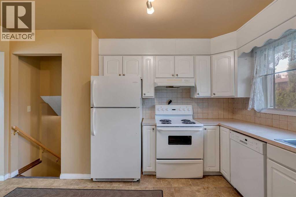 703 Woodpark Boulevard SW, Calgary, Alberta T2W 3M9 - Photo 9 - A2325598