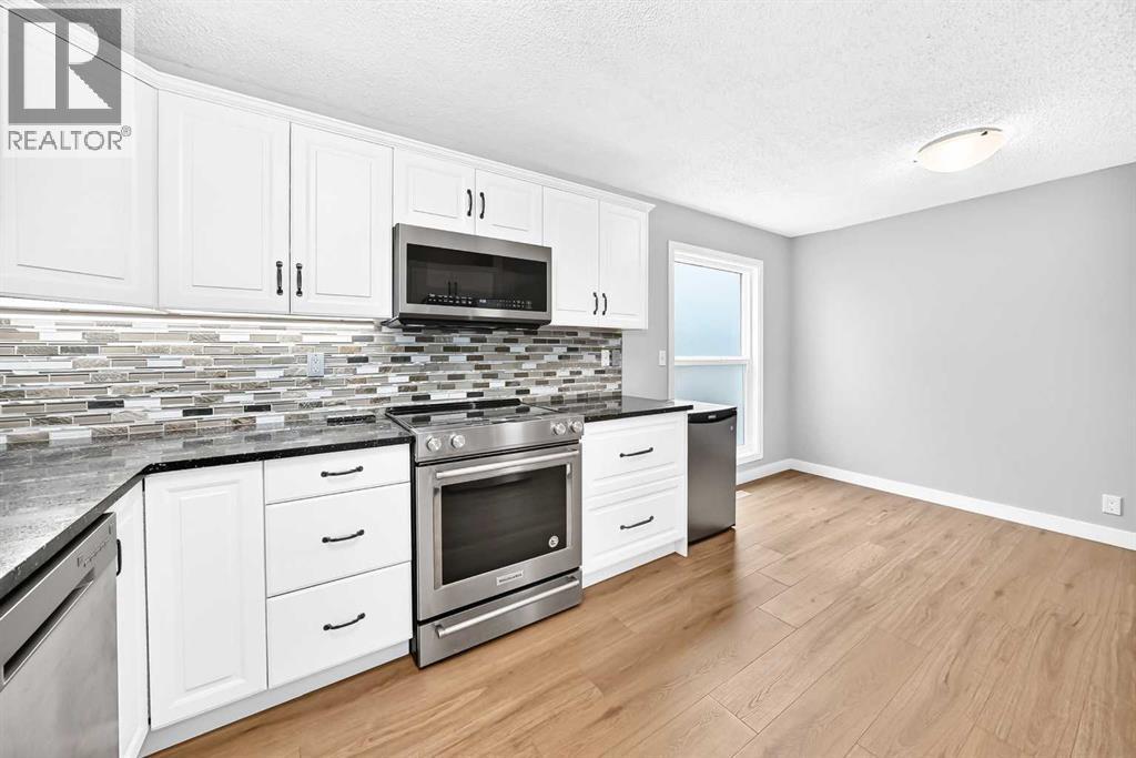 8 Hawkfield Crescent NW, Calgary, Alberta T3G 1Z5 - Photo 6 - A2339371