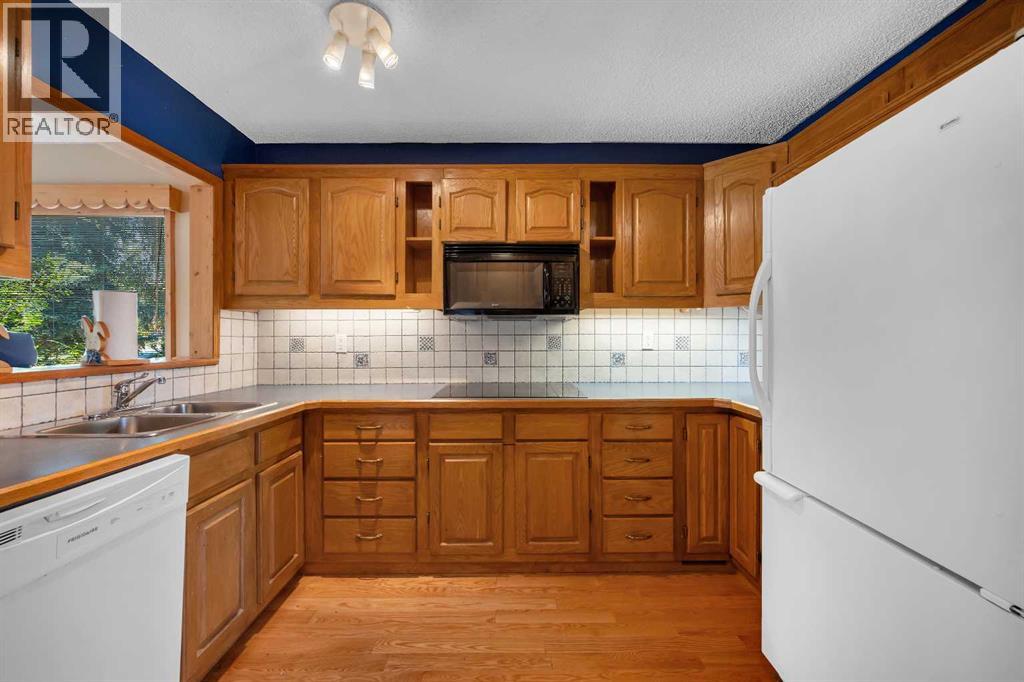 124 Macewan Drive NW, Calgary, Alberta  T3K 2P7 - Photo 12 - A2338025