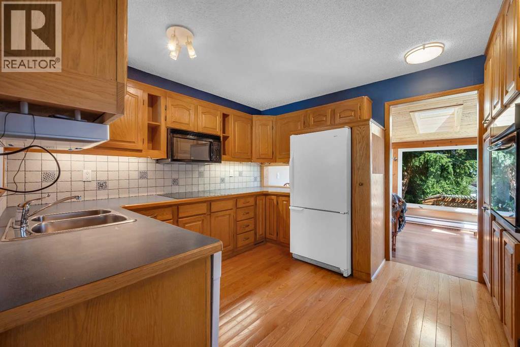 124 Macewan Drive NW, Calgary, Alberta  T3K 2P7 - Photo 10 - A2338025
