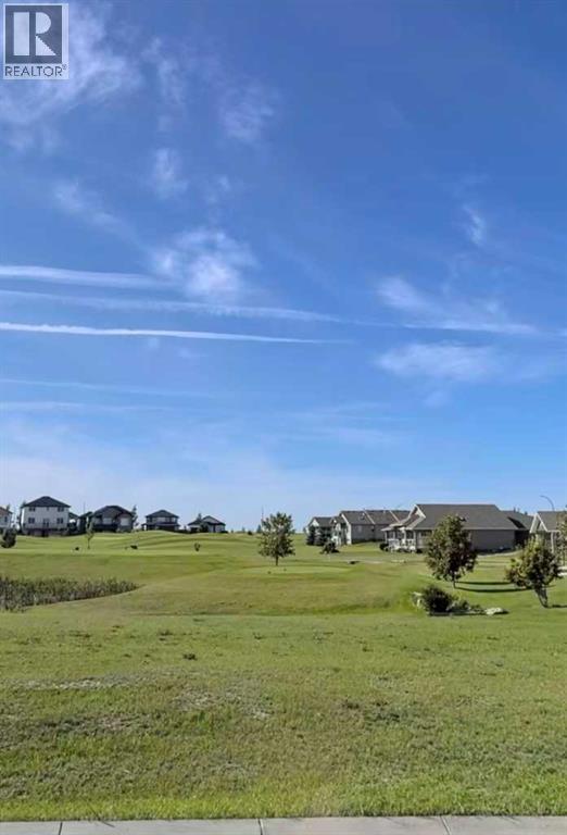 709 Whispering Greens Avenue, Vulcan, Alberta  T0L 2B0 - Photo 3 - A2303306