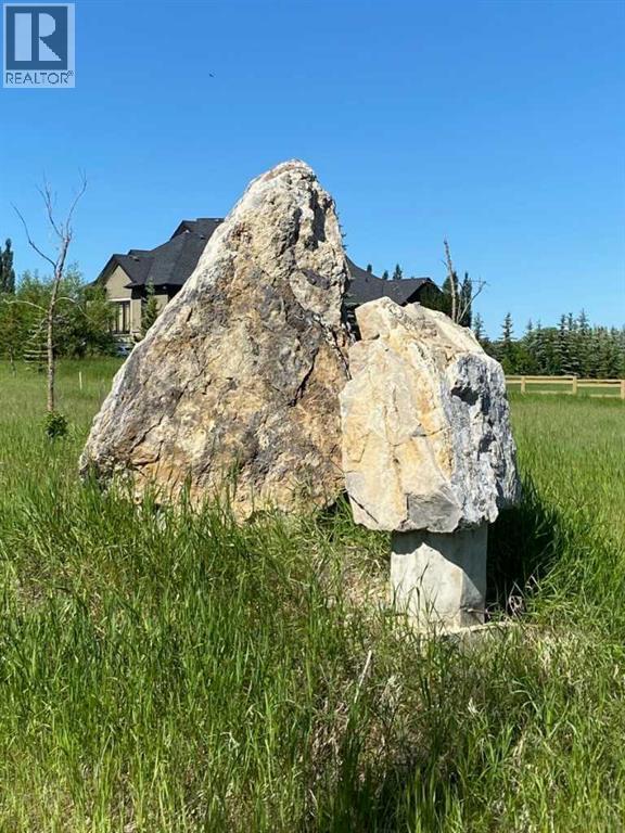 15 Grizzly Way, Rural Rocky View County, Alberta  T4C 0B5 - Photo 2 - A2336293