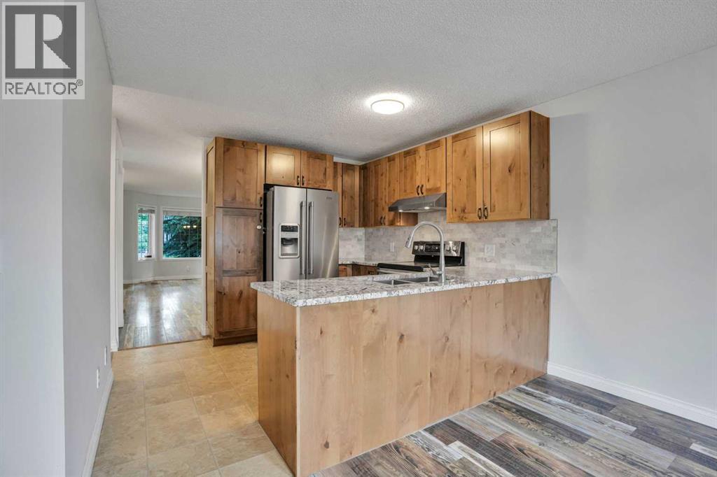 7152 Sierra Morena Boulevard Sw, Calgary, Alberta  T3H 3G8 - Photo 10 - A2330808