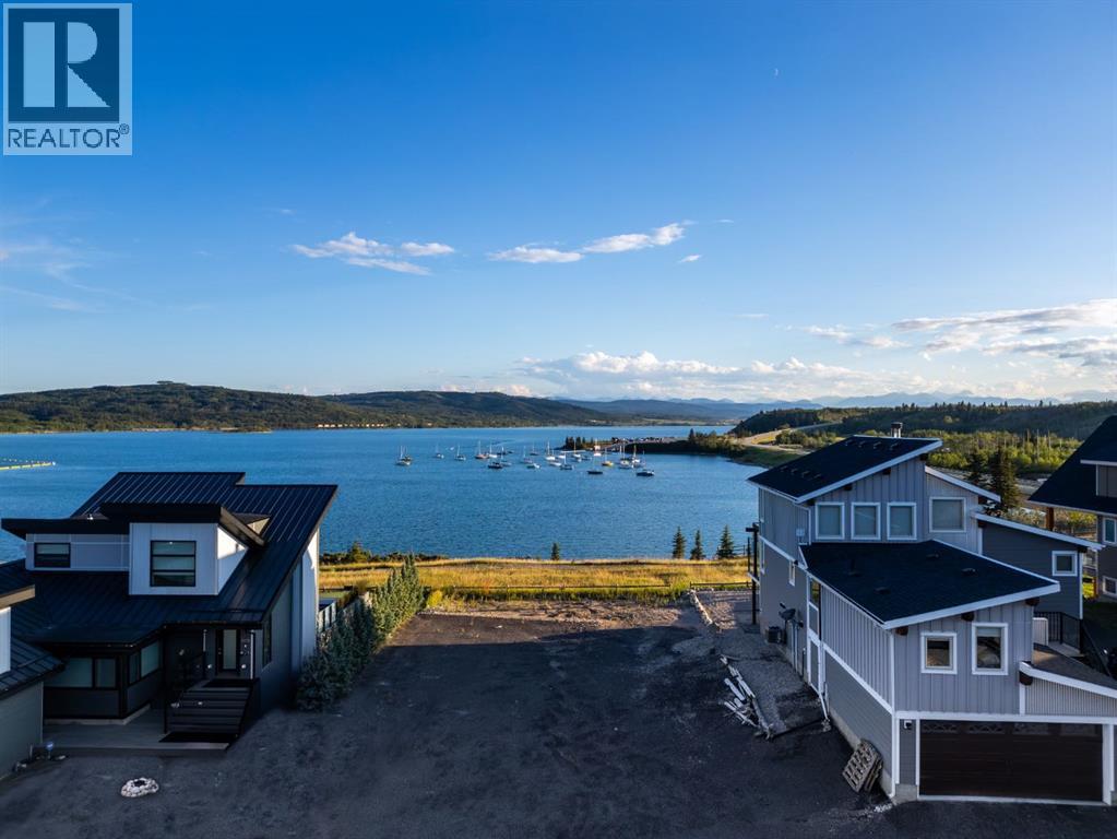 407 Cottageclub Grove, Rural Rocky View County, Alberta T4C 1B1 - Photo 1 - A2289756