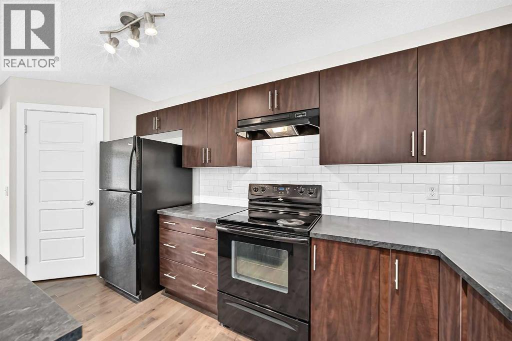 152 Pantego Lane NW, Calgary, Alberta  T3K 0T1 - Photo 8 - A2338088
