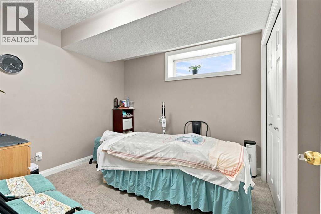 113 Rocky Ridge Point NW, Calgary, Alberta  T3G 4R5 - Photo 31 - A2340821