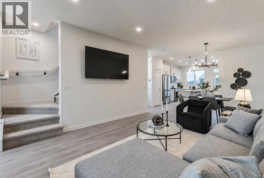 270 Creekside Manor SW, Calgary, Alberta  T2X 4B9 - Photo 4 - A2336327