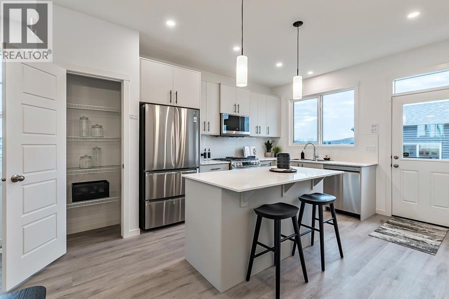270 Creekside Manor SW, Calgary, Alberta  T2X 4B9 - Photo 2 - A2336327