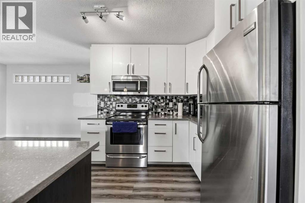 8035 Huntwick Crescent Ne, Calgary, Alberta  T2K 4H7 - Photo 9 - A2338472