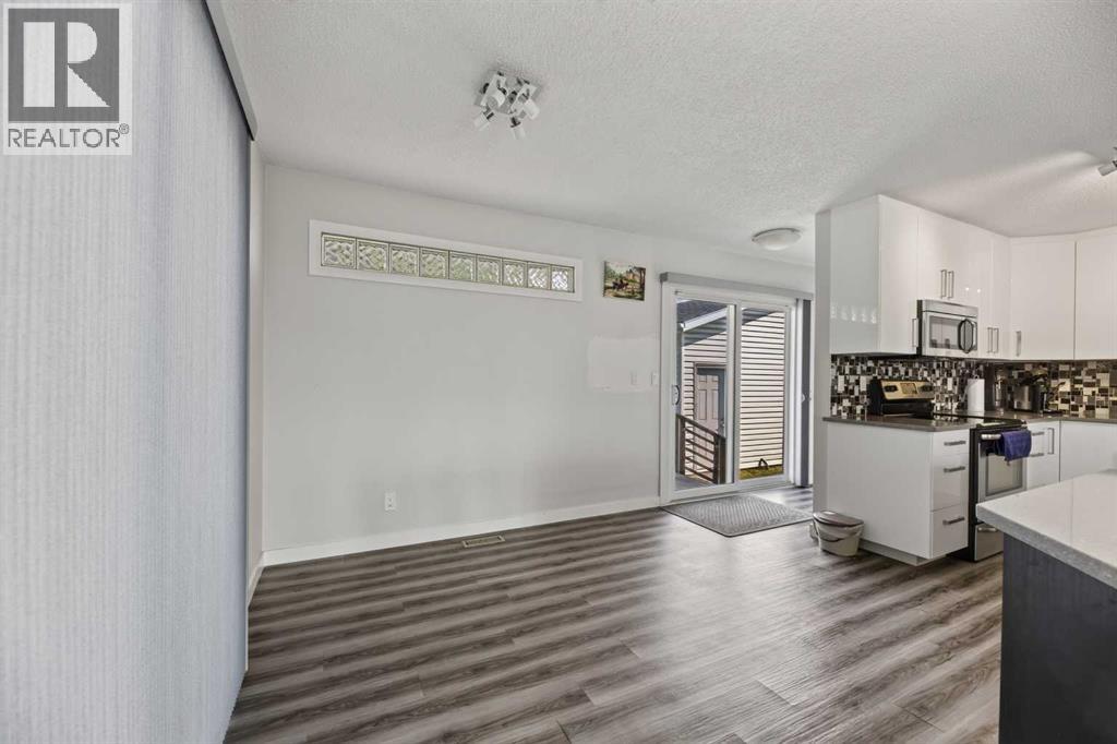 8035 Huntwick Crescent Ne, Calgary, Alberta  T2K 4H7 - Photo 6 - A2338472
