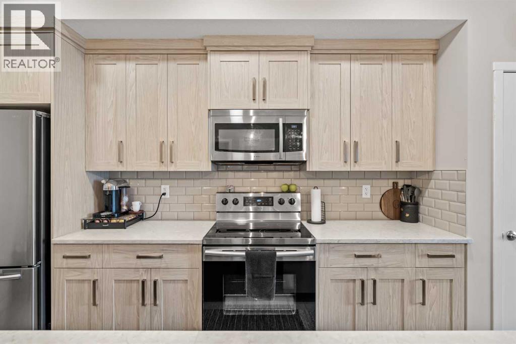 205, 370 Harvest Hills Common, Calgary, Alberta T3K 2M8 - Photo 3 - A2342616