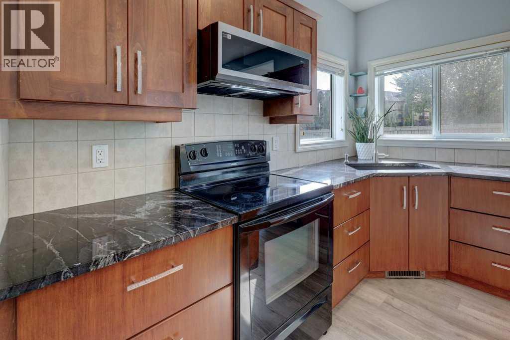 242 Crystal Green Point, Okotoks, Alberta  T1S 2K7 - Photo 4 - A2330836