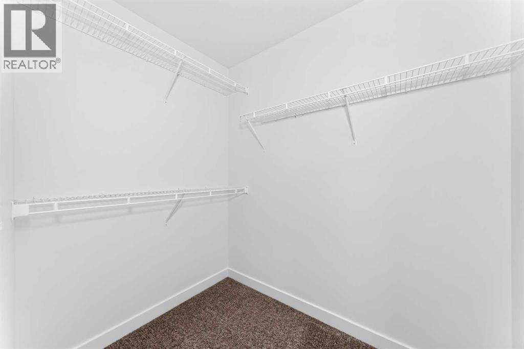 96, 145 Chelsea Mews, Chestermere, Alberta  T1X 3H1 - Photo 31 - A2335587