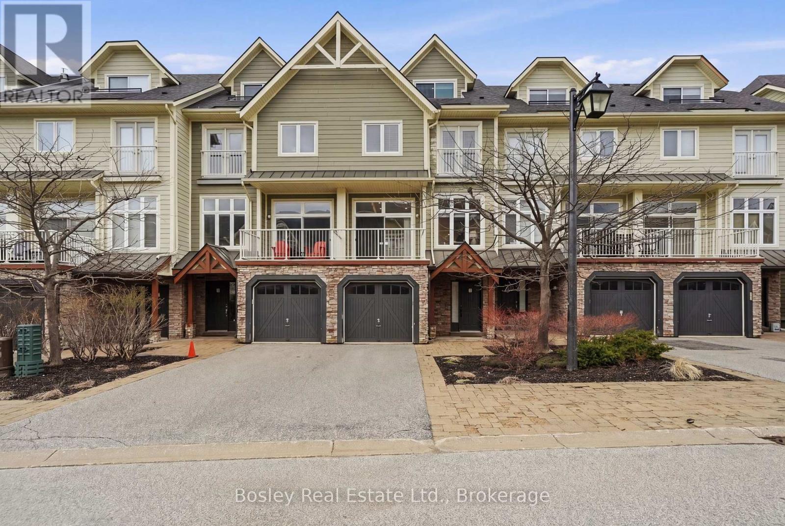Fall is around the corner, and ski season isn't far behind.Just steps from the Village at Blue Mountain, this beautifully renovated townhome offers over 2,500 sq ft of finished living space and an effortless four-season lifestyle in one of the area's most sought-after locations. Whether you're looking for a full-time home, a weekend escape, or a place to gather after a day on the slopes, this is a home designed to be enjoyed in every season. With over $200,000 in thoughtful upgrades, nearly every detail has been elevated. The fully finished loft is a standout, featuring a custom staircase, added window, shiplap ceilings, an 85-inch TV, and beautiful views toward the hills. It's the kind of space made for movie nights, après ski, or simply settling in after a day outside. The third level also offers additional sleeping space, making it easy to host family and friends for weekends at the mountain. The main floor is bright, open, and inviting, centred around a cozy new fireplace (2026). The kitchen has been completely updated with new cabinetry, countertops, and appliances, while fresh paint, new lighting, pot lights, and hardwood flooring throughout the upper levels create a warm and cohesive feel. The lower level continues the attention to detail with new tile and a beautifully finished bathroom with glass shower. Behind the scenes, the major work has been taken care of too, including a newer roof (2024), updated furnace, dehumidifier, tankless hot water system, and A/C wall units. Outside, the expanded back deck is ready for crisp fall evenings, après ski drinks, summer dinners, and everything in between. Best of all, it's offered fully furnished, making this a true turnkey opportunity. Arrive with your bags, unpack, and start enjoying Blue Mountain. Condo fees include snow removal, grass cutting, internet, and cable, giving you a low-maintenance lifestyle with more time for the things you came here to enjoy. Pool access is also available for a minimal fee. (id:48254)