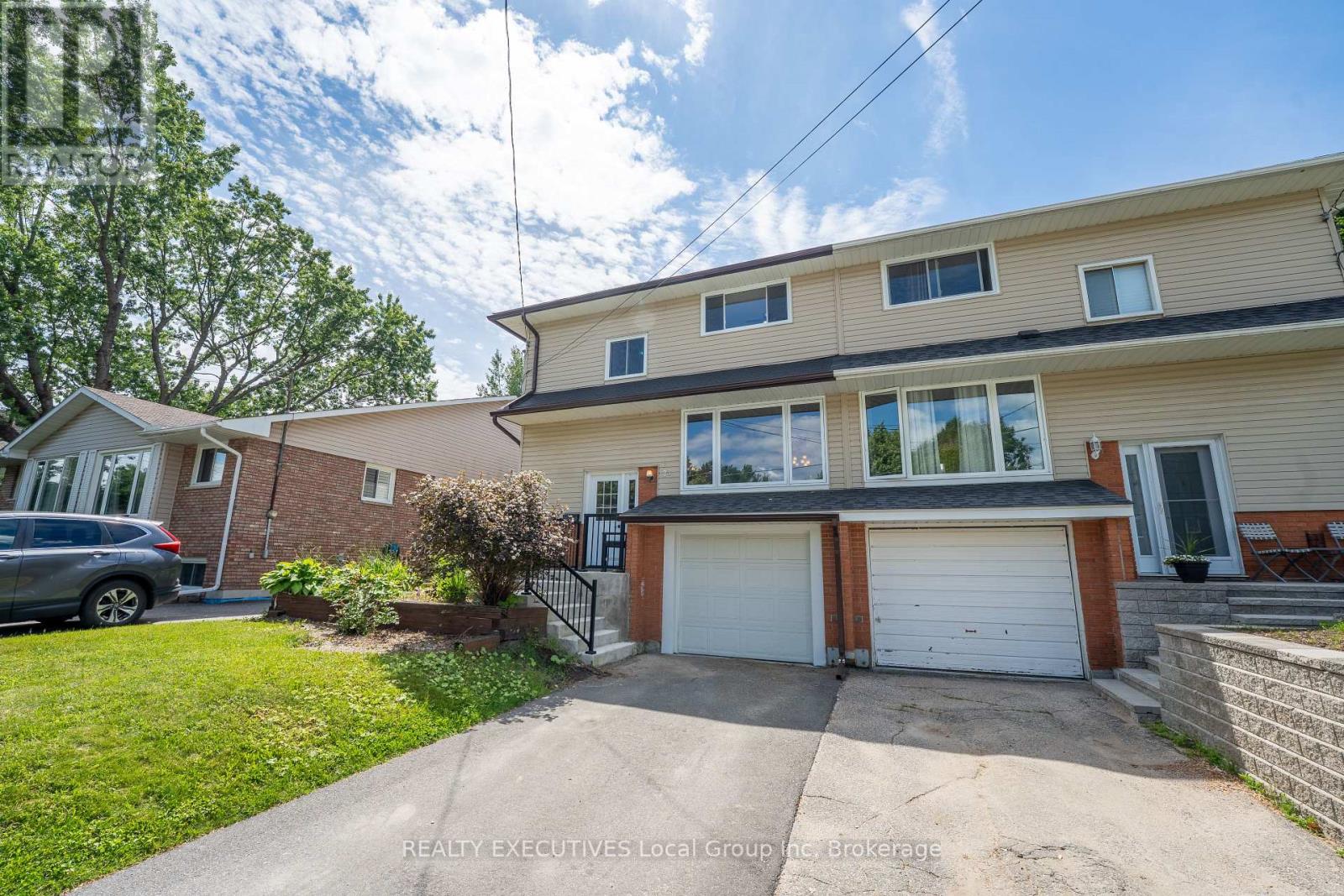 Welcome to this well-maintained semi-detached home in the highly sought-after Birchaven neighbourhood. Enjoy an exceptional lifestyle just steps from parks, the outdoor rink, scenic walking trails, and an easy stroll to Armstrong Beach on beautiful Trout Lake.  The main floor features an updated kitchen with a walkout to a spacious deck overlooking a private backyard-perfect for entertaining, family gatherings, or relaxing outdoors. Upstairs offers three generously sized bedrooms, providing plenty of space for a growing family.  Major updates have already been completed for peace of mind, including windows (2026), furnace and AC (2021). Located in one of North Bay's most desirable family-friendly communities, this home combines comfort, convenience, and access to some of the city's best outdoor amenities. (id:48254)