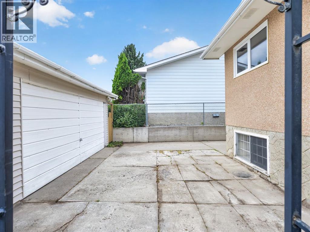 1219 Hunterquay Hill NW, Calgary, Alberta  T2K 4T3 - Photo 6 - A2342711