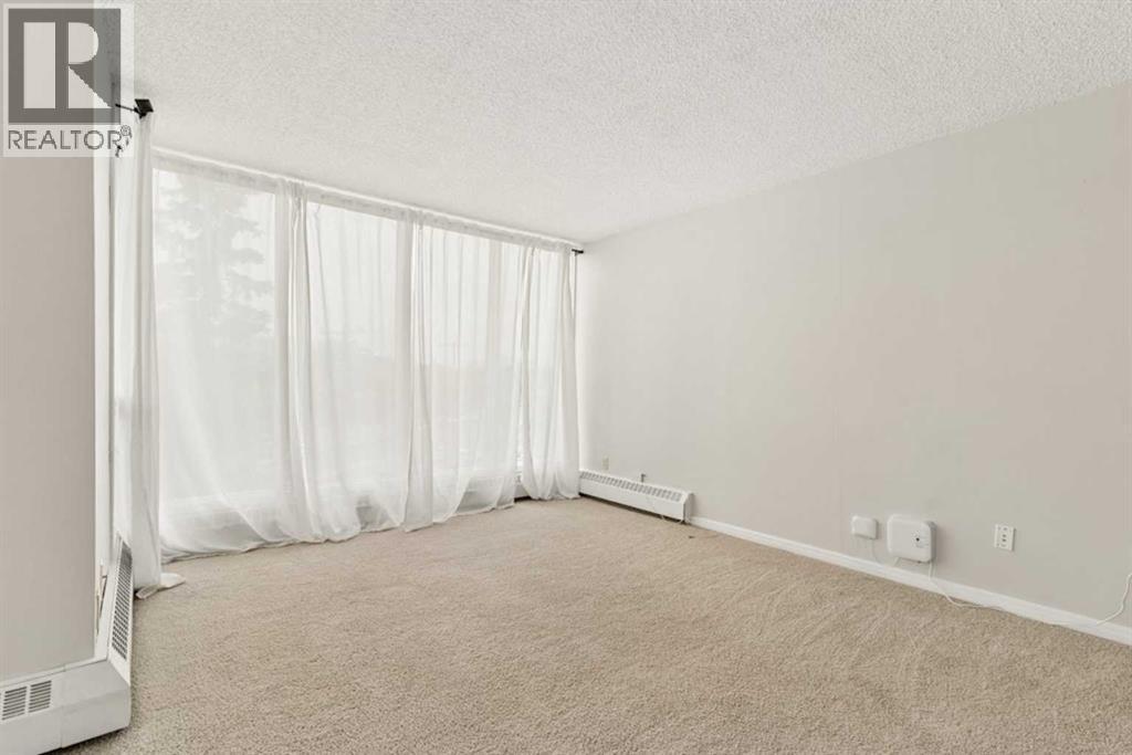 401, 145 Point Drive NW, Calgary, Alberta  T3B 4W1 - Photo 3 - A2329414