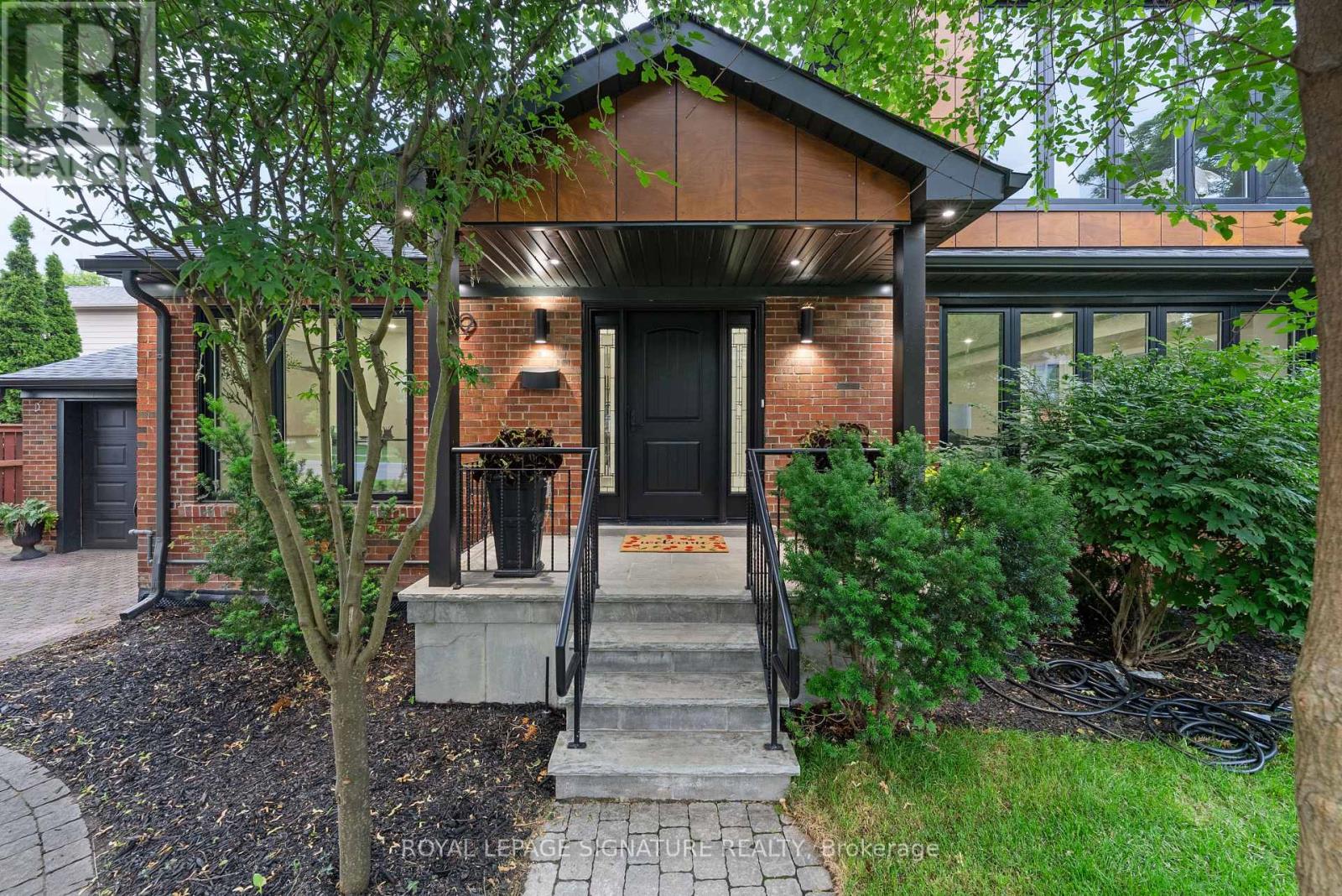 Not a renovation. A reinvention. 29 Blaketon Road was gutted to the studs. Every system,finish, and detail replaced-and rebuilt into the kind of home that rarely comes to market. Seton a premium 62132 ft lot in Islington Village, it offers new-construction quality on one of Etobicoke's most established, tree-lined streets.A marble-look tile foyer opens to formal living and dining spaces with wide-plank hardwood,coffered ceilings with dark wood crown detailing, and a show stopping wet bar featuring book-matched quartzite from counter to ceiling, walnut cabinetry, and a wine fridge. A sleek glass-panel railing leads to the step-down family room, complete with a coffered ceiling,dramatic dark walnut feature wall, gas fireplace with black granite surround, and garden doors to the deep, serene backyard. Two distinct spaces, connected by sightlines and designed with purpose.The chef's kitchen anchors the rear of the main floor with Jenn Air appliances, a pro-graderange, quartzite backsplash, generous island, and prep kitchen. A queen-sized fourth bedroom with a nearby four-piece bath creates a true in-law or guest suite, while main-floor laundry completes the level. Upstairs, a circular dome skylight fills the landing with light. The primary suite offers a vaulted truss ceiling, walk-in dressing room, and spa-like ensuite with a double walnut vanity and full-height marble slab shower. Each additional bedroom has its own ensuite and overlooks the backyard. The lower level includes a nanny suite with bath, flexspace, and storage.A 1.5-car garage with EV charger, plus two private drive parking spaces, completes this exceptional offering. An extensively rebuilt family home where scale, finish, and function have all been considered. (id:48254)