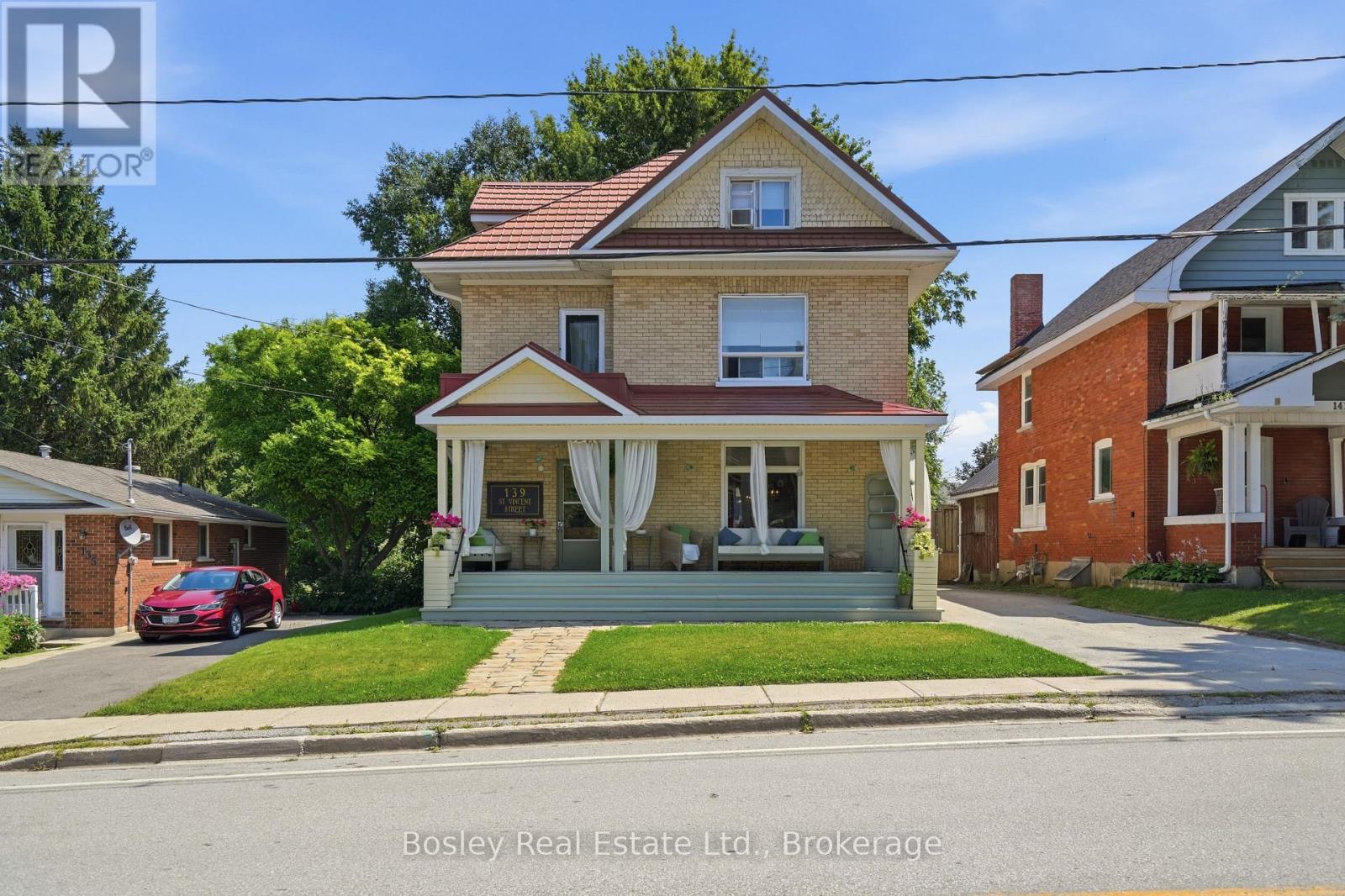 Some homes just have a feeling to them, and this is one of them. Set in the heart of Meaford, steps from the marina and Georgian Bay and just minutes from the shops, restaurants and charm of downtown, this historic double yellow-brick home offers the kind of lifestyle that makes small-town living so special. Before you even step inside, the large covered front porch invites you to slow down. Morning coffee, a book on a rainy afternoon or catching up with a friend, it feels like an extension of the home itself. Inside, the character of this historic home has been thoughtfully preserved while extensive renovations have made it comfortable for modern living. Restored hardwood floors, original pocket doors and beautiful trim are paired with an updated kitchen with a perfect layout, renovated bathrooms, updated lighting and the addition of a main-floor bathroom. Two separate living spaces on the main floor provide plenty of room for family life and entertaining. With four bedrooms plus a den, there is flexibility for family, guests or a home office, while the third-floor primary suite creates a private retreat away from the rest of the home. Upstairs laundry adds everyday convenience. Outside, the impressive 55 x 165 ft lot offers a large backyard with room for kids and pets to play, gardens, summer dinners and plenty of space to make your own. Improvements include restored hardwood and pocket doors, renovated bathrooms, landscaping, fencing, decks and walkway, crown moulding, lighting, stone countertops, plaster and ceiling work, upstairs laundry and the covered front porch. And then there's the location. Meaford offers some of the most beautiful waterfront in Southern Georgian Bay, with the marina and Georgian Bay practically at your doorstep and its charming downtown minutes away. Approximately 20 minutes to Blue Mountain and 30 minutes to Collingwood, you get the slower pace of small-town living without giving up easy access to everything the area has to offer. (id:48254)