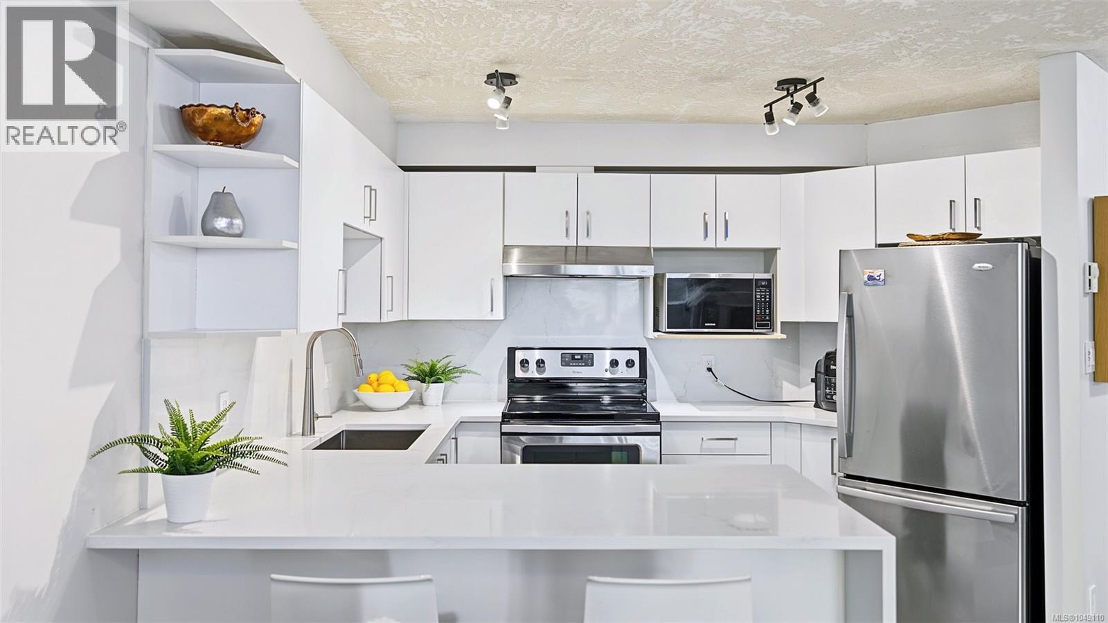Brand new cabinet doors, Quartz counters and Quartz backsplash!!!