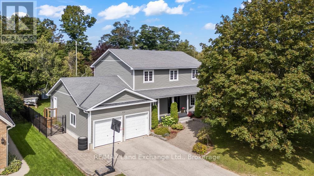 This "Quality Manufactured Home" was built in 1993 and is located at 932 Parkwood Drive, backing onto the ravine; making the location one of the most desirable in Port Elgin.  With over 2553 sqft above grade it has been beautifully maintained featuring 4 bedrooms and 3.5 baths; it's a classic style for formal and informal entertaining.  The main floor features a formal living room (or bright office), formal dining room and spacious entrance foyer.  Across the back is where the memories are made; the eat-in kitchen walks out to the stunning fully fenced backyard and overlooks the family room; ideal for keeping an eye on the kids while dinner is being prepared.  There is a large mudroom, powder room and separate laundry room off the 2-car garage.  Upstairs there are 4 bedrooms; and 2 updated baths.  The basement has more finished space for added enjoyment.  The location is minutes from Northport Elementary and the beach, the walking and cycling trails can be accessed from a gate in the backyard. It's move in ready, the shingles were replaced in 2010, 2nd floor windows, LR & DR in 2021, ensuite bathroom 2023, deck & patio 2021, cement board siding 2012.  This home is R2000 certified, the annual hydro costs are approximately $2600; annual gas costs approximately $750. (id:48254)