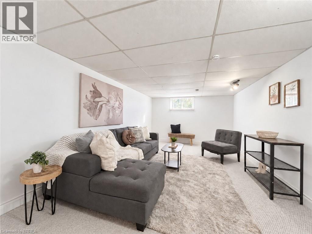Recessed ceiling tiles, built-in track lighting, and a window with natural light