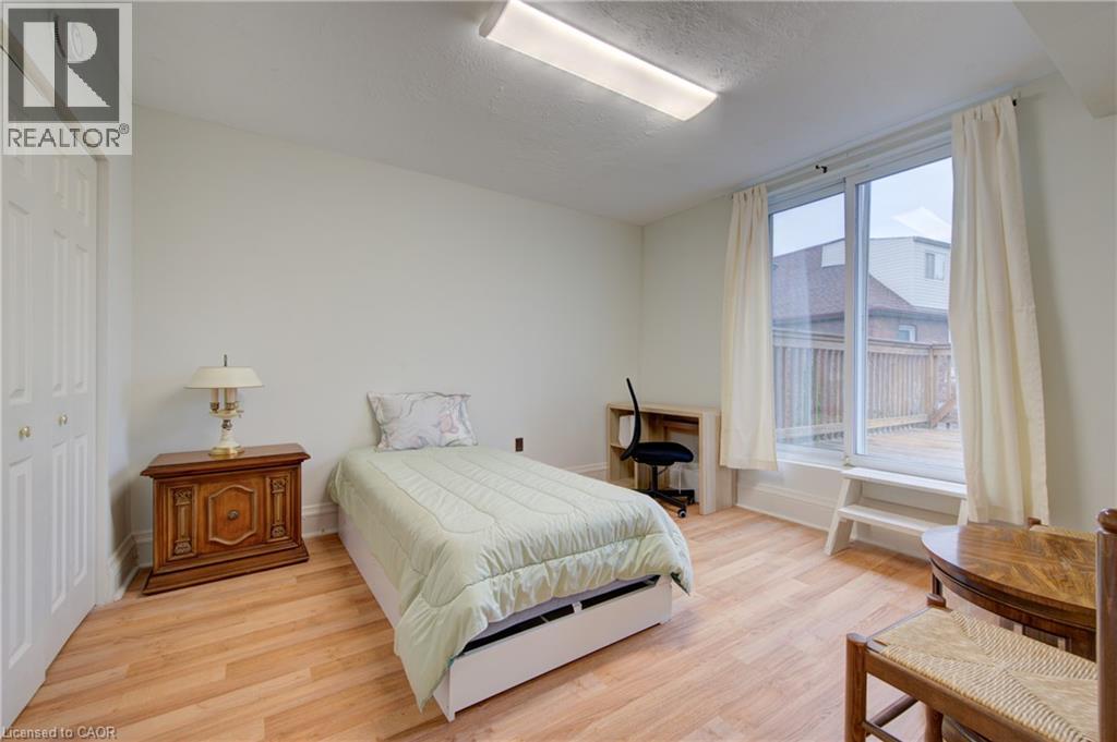 Bedroom 2 with private deck overlooking backyard