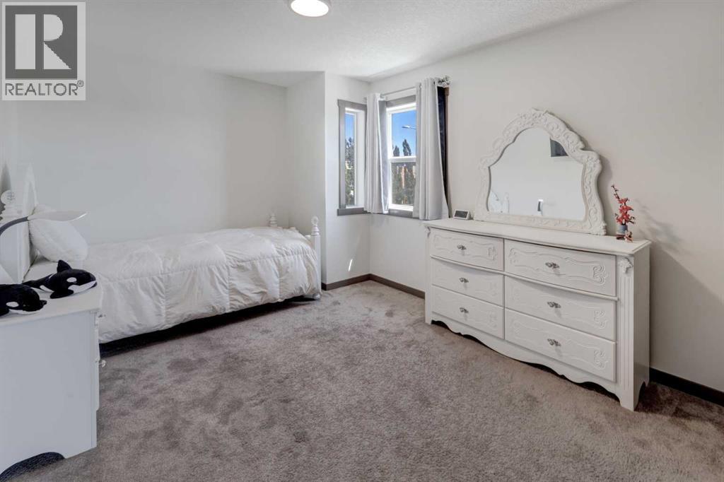 5 Covecreek Mews NE, Calgary, Alberta T3K 0V8 - Photo 22 - A2324736