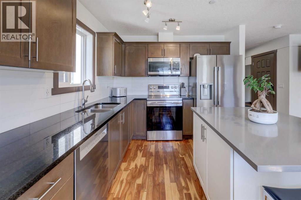 5 Covecreek Mews NE, Calgary, Alberta T3K 0V8 - Photo 9 - A2324736