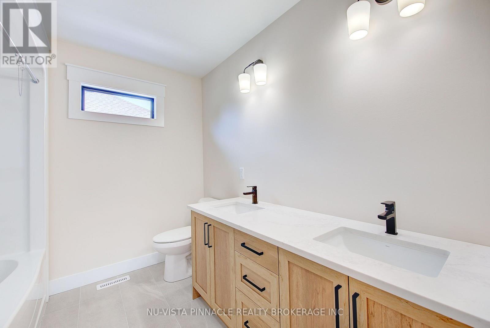 77 Basil Crescent, Middlesex Centre, Ontario  N0M 2A0 - Photo 32 - X13799712