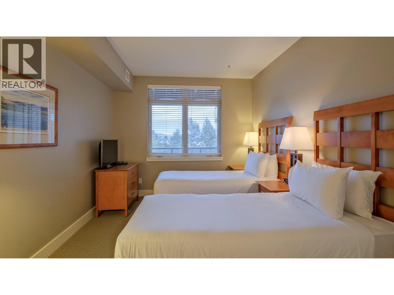 Large second bedroom with lake views