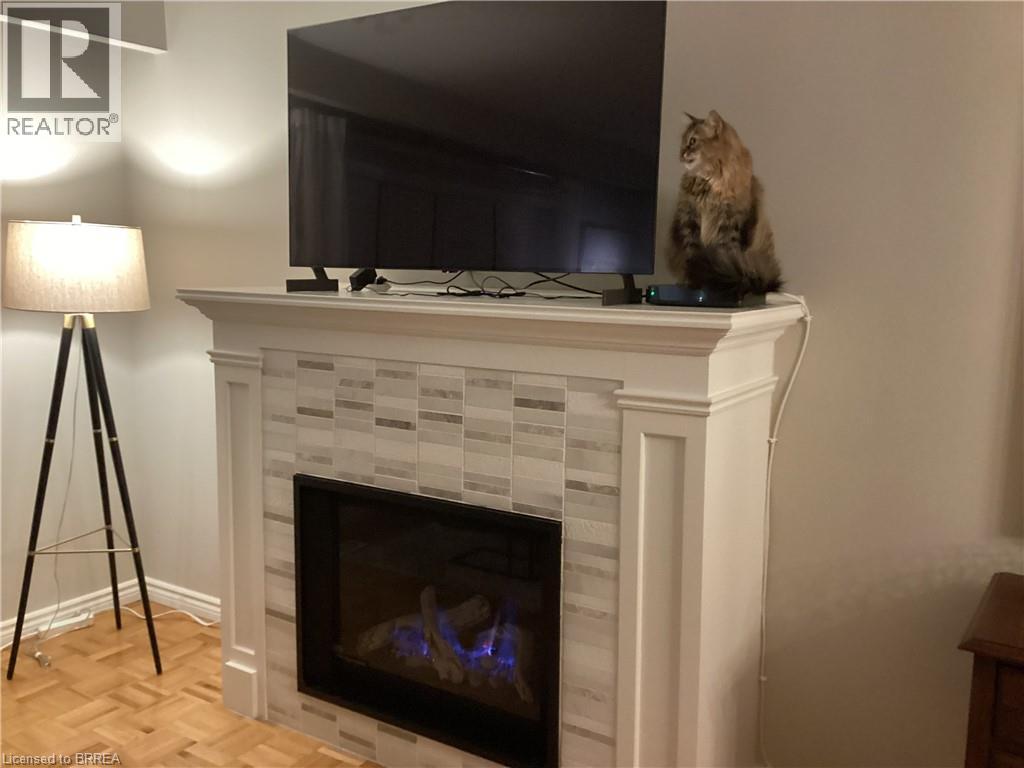 Built-in fireplace with a tile surround and mantel