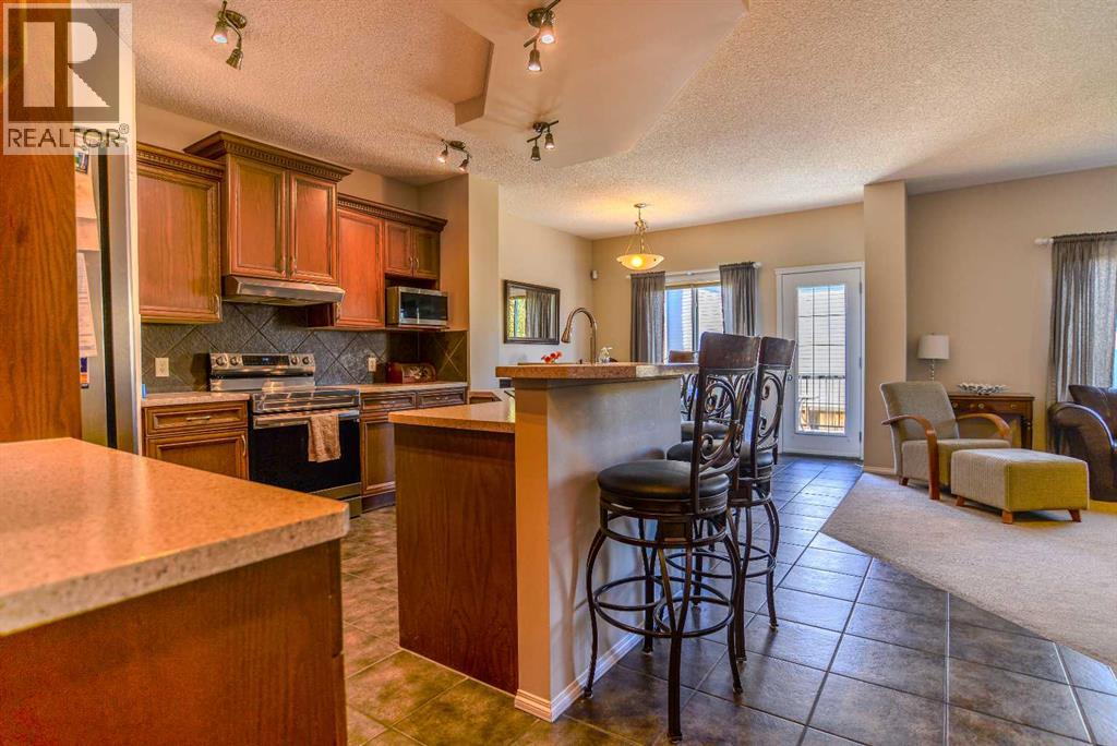 78 Tuscany Ridge Heights NW, Calgary, Alberta  T3L 2W8 - Photo 7 - A2346266