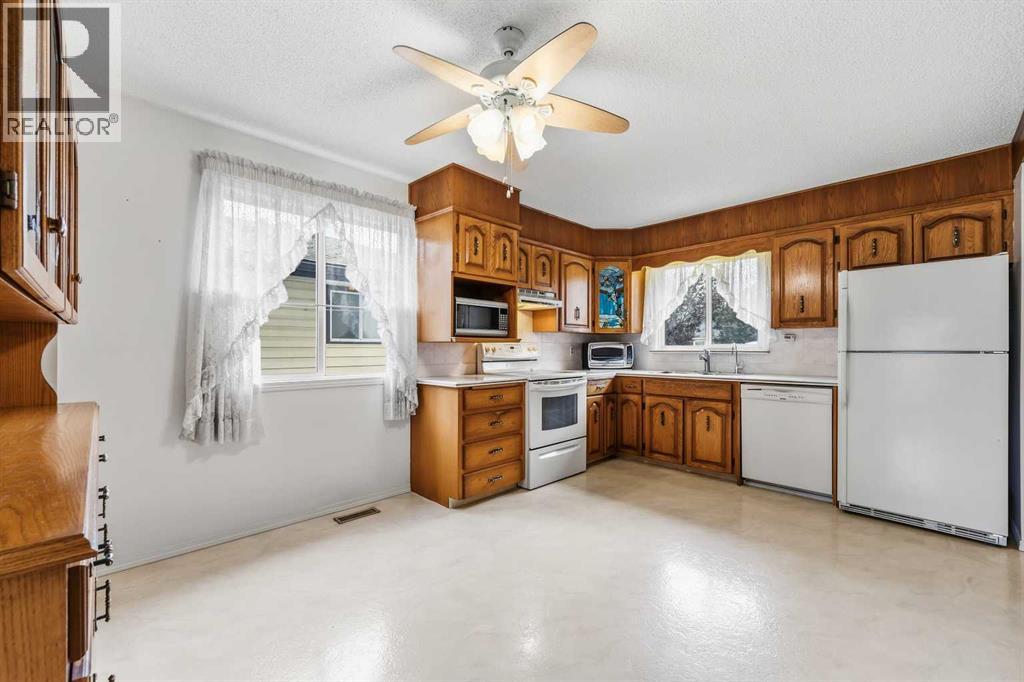7944 Huntington Road NE, Calgary, Alberta  T2K 5A3 - Photo 11 - A2345682