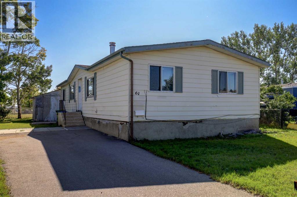 61 Huntstrom Drive NE, Calgary, Alberta  T2K 5V5 - Photo 1 - A2345587