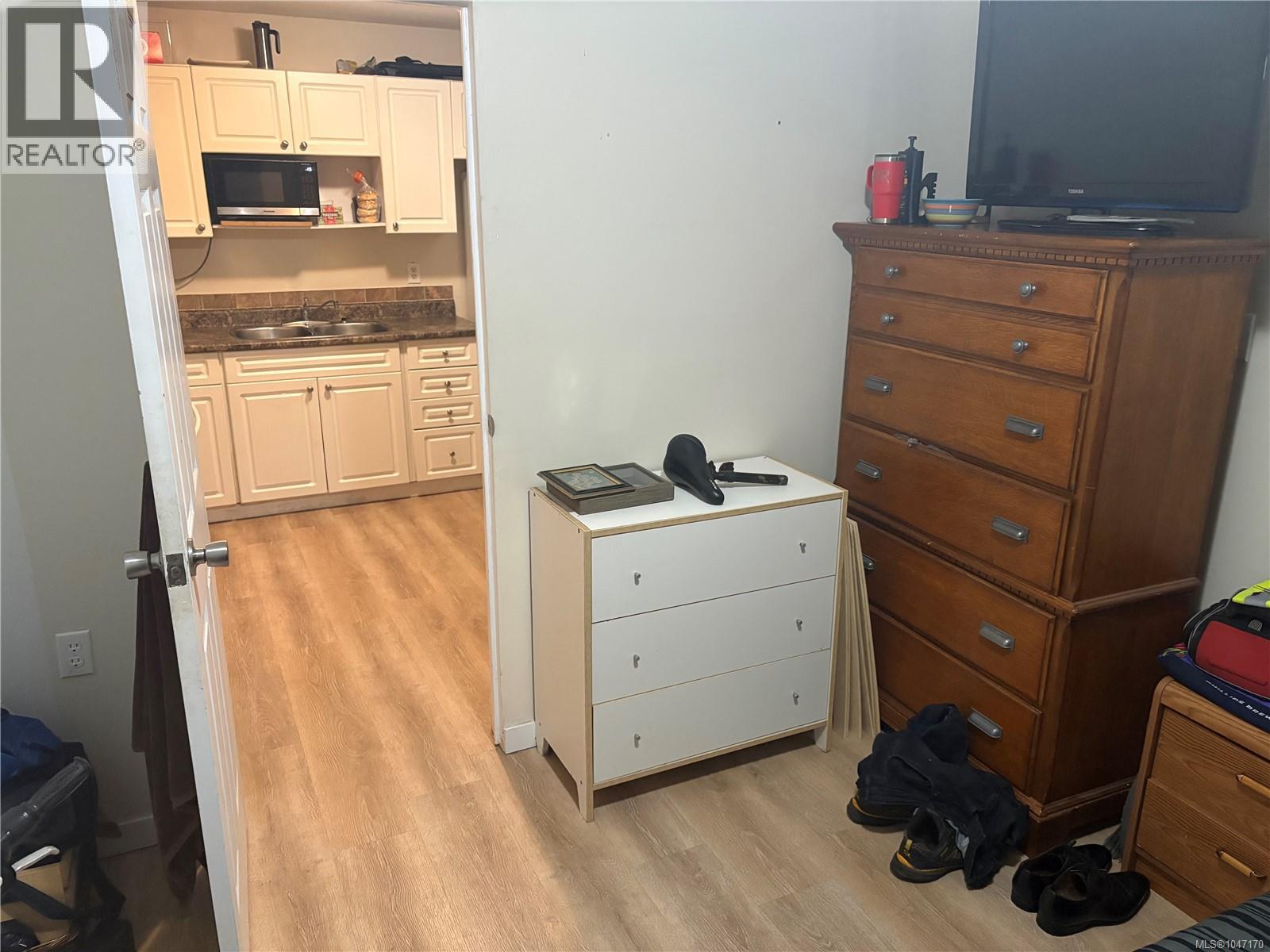 View of kitchen from the back bedroom