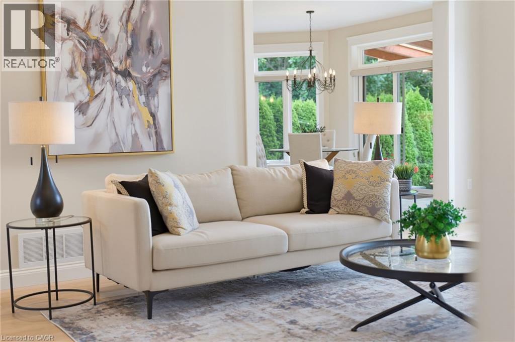 Spacious interior featuring neutral wall tones, large windows, and recessed lighting