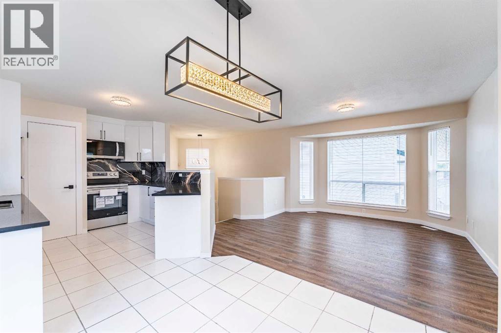 206 Saratoga Close NE, Calgary, Alberta  T1Y 7A1 - Photo 1 - A2346246