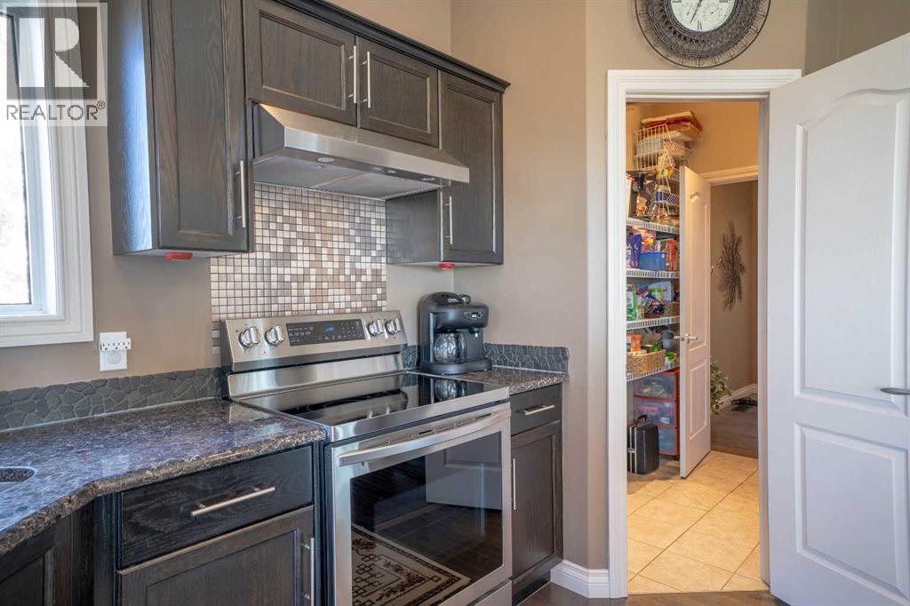 460 Sunset Link, Crossfield, Alberta  T0M 0S0 - Photo 11 - A2347495